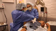 Dr. Lee performing surgery on Inoke.