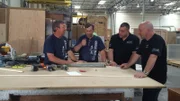 Rick and Vic talking to Brett and Wayde in the shop during the build process.