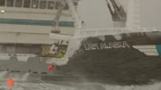 An iced up Lady Alaska pulling up a pot in ice cold rains.