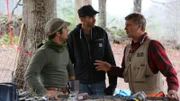 Pete Nelson talking to two build team members during the treehouse build.