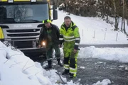 Odda, Norway - (Left to Right) Jarle Hauksland and Thord Paulsen. Jarle Hauksland is a local guy helping Thord to rescue the trash truck that has one of the wheels in the ditch. They are planning how to do the operation.   (National Geographic)