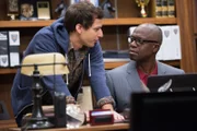 On left: Jake Peralta (Andy Samberg) and on right Captain Ray Holt (Andre Braugher).