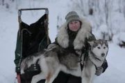 Ashley Selden playing with dog before sleigh ride.