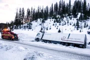 Overhalla, Norway - A big truck in the ditch and a towing truck ready to rescue the big truck.