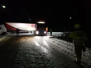 Overhalla, Norway - A truck has slipped on the slippery road, blocking other cars to pass.