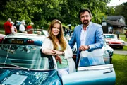 Close up of Richard Hammond and Mindy Hammond posing with Richard’s Jaguar E-Type.