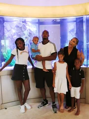Adrian and his family in front of their new tank.