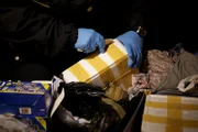 Luggage is inspected by a Customs and Border Protection officer at John F. Kennedy International Airport. (Photo Credit: National Geographic Television)