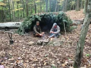 Matt Graham and Joe Teti with shelter and fire.