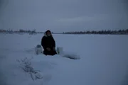Heimo Korth is ice fishing.