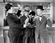 Oliver Hardy, Arthur Housman, Stan Laurel.