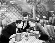 Oliver Hardy, James Finlayson, Stan Laurel.
