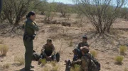 SONORAN DESERT, ARIZ.- CBP Agent, Nicole Ballistrea, finds three exhausted and dehydrated migrants who have been trekking through the desert for 9 days.