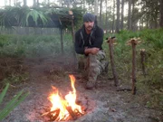 Joe Teti posing by fire.