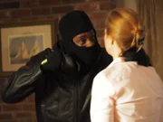 Masked attacker threatens CeCe with force.