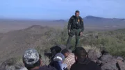 Nogales, AZ: An agent talking to a group of apprehended men. USA border agents work to stop human trafficking and the smuggling of drugs and weapons.