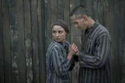 Jonah Hauer-King as Lali Sokolov & Anna Próchniak as Gita Furman in Auschwitz.