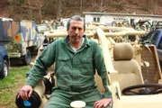 Michael Manousakis sitting in Jackal Type 21 vehicle.