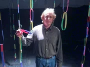 Jamey Marth, Ph.D., Director, Center for  Director, U. of California, Santa Barbara: Demonstrates how to create anti-viral drugs using CRE recombinase as he cuts down a forest of DNA created from loops of colored paper.