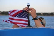 Warden McGinley tying up American flag.