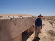 Author & Historian James Holland looking at bullet holes in a bunker on the Mareth Line in Tunisia.