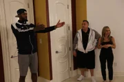 Paul shows Wayde and Agens the spot he picked out for his tanks.
