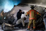 The search for survivors and clues continues as firefighters and rescuers (played by background actors) continue to search the wreckage of Continental Airlines Flight 1713.