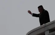 Kim Jong-Un waves during a military parade in Pyongyang to celebrate the 105th anniversary of the birth of his grandfather, North Korea's first leader, Kim Il-Sung. (AP / Rex / Shutterstock)