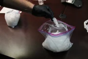 Officer David Schweizer holds pure crystal methamphetamine called "shard." (National Geographic/Lucky 8 TV)