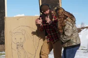 Matt Raney teaching Lorinda Adams how to shoot a bear at the Garcia Homestead in Fort Garland, Colorado.