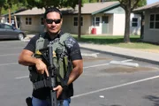 FRESNO, CALIF.- Eric, Fresno PD, is at a raid holding a gun.