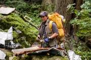 Lincoln, Ontario - Ony Wibowo (played by Xavier de Guzman) sorts through the debris from the Sukhoi Superjet wreckage on Mount Salak, Indonesia.