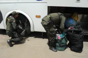 IPIALES, COLOMBIA- National Colombian Police checking luggage.