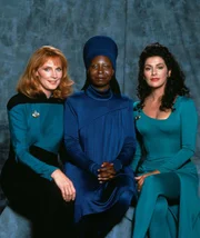 L-R:  Dr. Beverly Crusher (Gates McFadden), Guinan (Whoopi Goldberg), Counselor Deana Troi (Marina Sirtis)