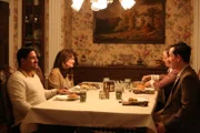 Howard Velzy and Carol Velzy dining with their neighbors.