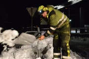 Odda, Norway - Thord Paulsen (main cast in Odda) are using a spade to move snow.