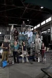 Cast members (L to R): Michael Raines, Allison White, Leilani Smith, John Valencia, Joey Sciacca (top), Diane Mariano (red), Vladimir Beck (topknot), Morgan Hooker (blue top), Amy West and John Cohn with the truck that they worked on on the set of The Colony.
