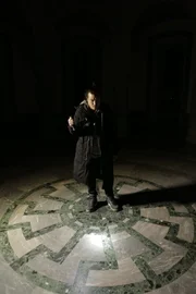 WEWELSBURG CASTLE, GERMANY - Robert Joe shines a light on the "Black Sun" symbol as he explores the Supreme Leaders' Hall in the dark.  (photo credit: FIC Singapore/Rob Taylor)