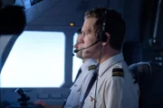 Second officer Ross Hales (played by Spencer Robson) and first officer Peter Lipsett (played by Dan Bowers) focus on the flight path of Quantas Airlines flight 72.  (photo credit: Cineflix/Darren Goldstein)