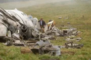 REENACTMENT - William McGrory (played by Benjamin James), a survivor of downed Ansett New Zealand Flight 703, attempts to dislodge wreckage in search of other survivors. (Cineflix 2020/Darren Goldstein)