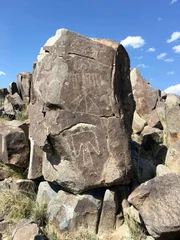 Native Americans (Jornada Mogollon people) carved petroglyphs on rocks at Three Rivers Petroglyph Site near Tularosa, New Mexico