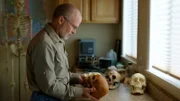 Dr. James C. Chatters examines replica skulls. (National Geographic/Mark Molesworth)
