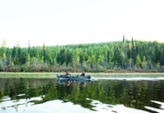 Picture Shows: DOP Devin Lund (VK in BG) filming Bentley Kakekayash moose hunting near Weagamow Lake, Ontario. (BTS)