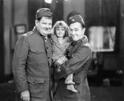 Oliver Hardy, Jacquie Lyn, Stan Laurel.