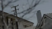 Phone and power lines above houses.