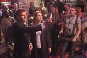 When Brennan (Emily Deschanel, R) and Booth (David Boreanaz, L) investigate the death of a rich adventure seeker, they are led to a rock-and-roll fantasy camp in the BONES episode "The Rocker in the Rinse Cycle"