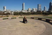 Austin, TX: Te'devan sits in a public park. He has decided to define his home as himself, and revision the Dream into one of spiritual virtue, and freedom from material motivations.   (Photo Credit: National Geographic Channels)