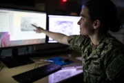 Lt. Caitlin Fine is a Meteorologist at the Joint Typhoon Warning Centre in Hawaii with responsibilities including USN Operations Officer & Typhoon Duty Officer. Her role involves forecasting to protect US Navy assets and interpret how weather impacts US Navy exercises.  (National Geographic/Nick Head)