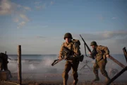 US soldiers storm the beach.