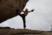 Boulevard, CA: Yogi Zen exercises on a large boulder, next to his cave home. (Photo Credit: National Geographic Channels)